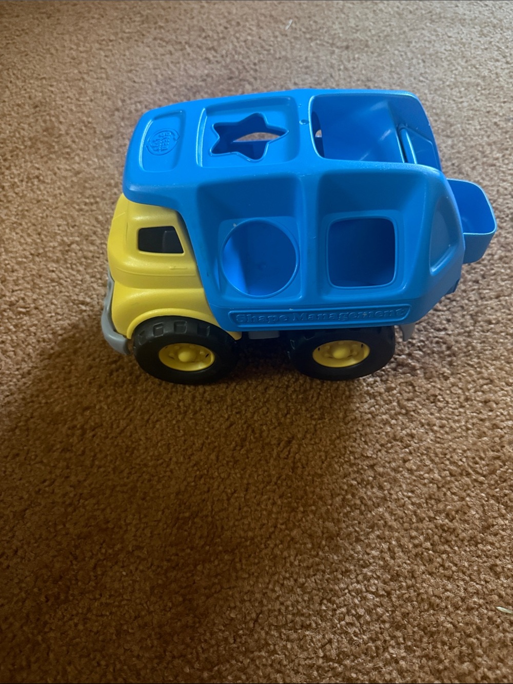 Green Toys Shape Sorter Truck designed for toddler developmental play